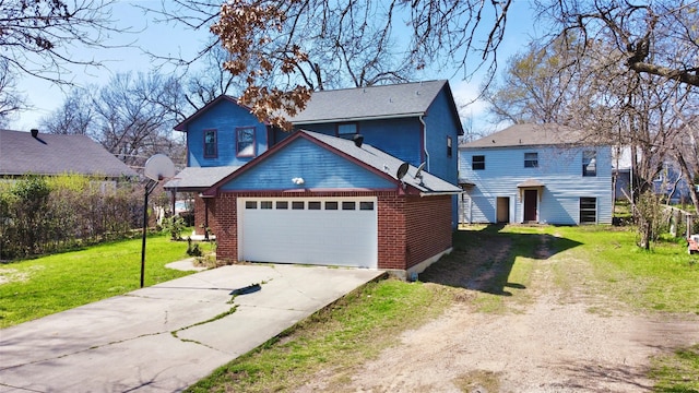 view of front of home with a garage and a front yard