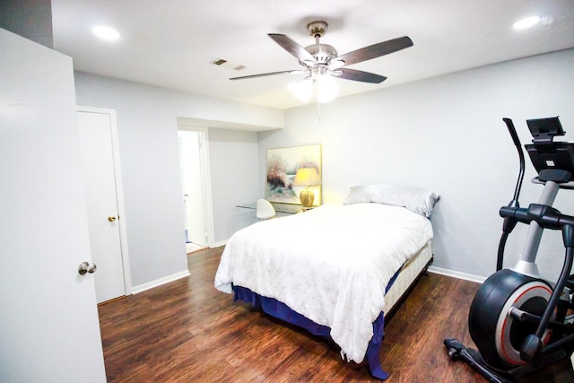 bedroom with ceiling fan and dark hardwood / wood-style floors