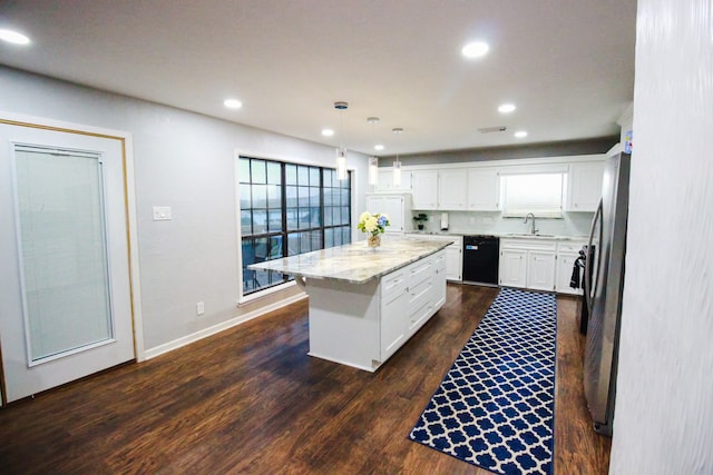 kitchen featuring decorative light fixtures, white cabinetry, black dishwasher, a kitchen island, and dark hardwood / wood-style flooring