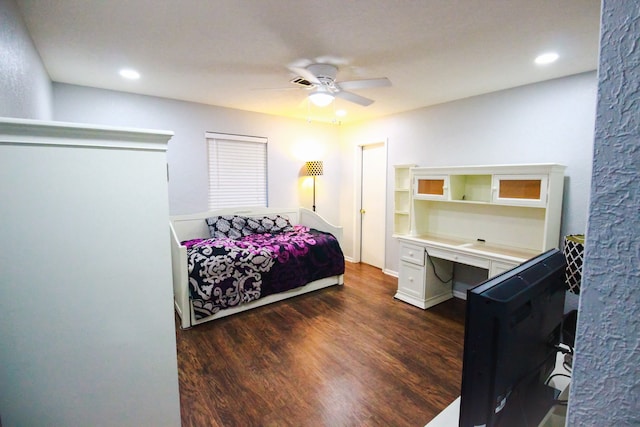 bedroom featuring ceiling fan and dark wood-type flooring