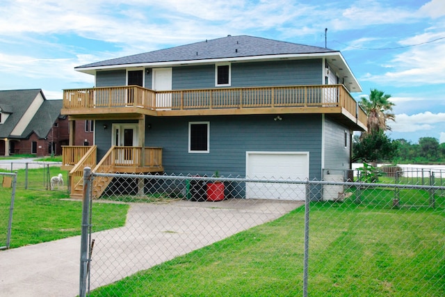 back of house with a yard, a balcony, and a garage