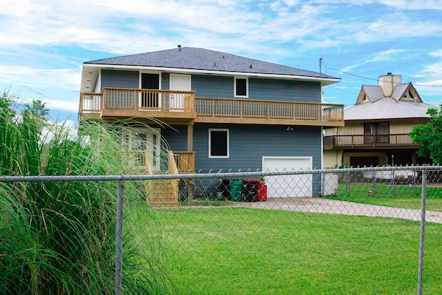 back of house with a yard and a balcony