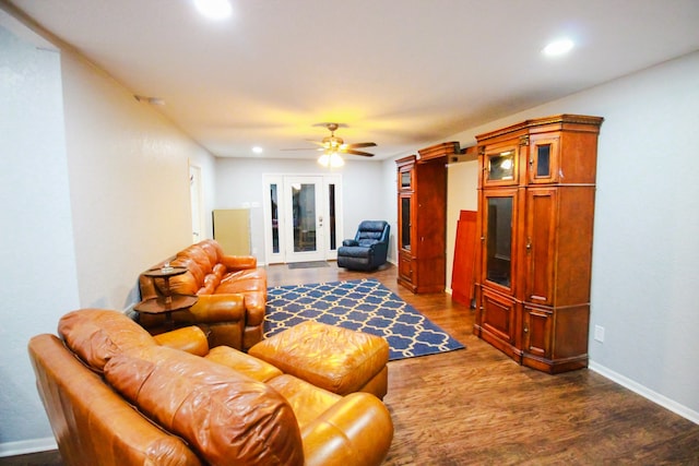 living room with french doors, ceiling fan, and dark wood-type flooring