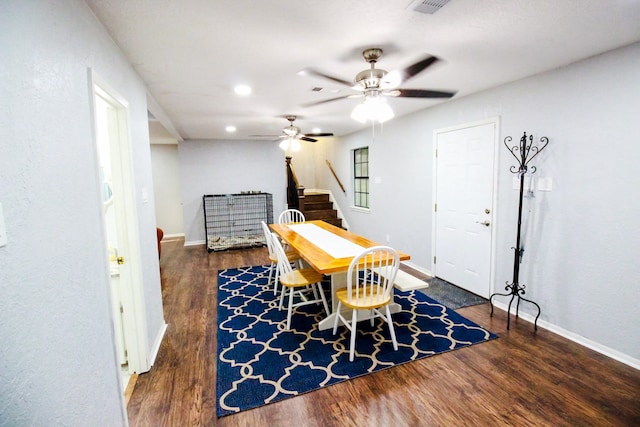 dining area featuring ceiling fan and dark wood-type flooring