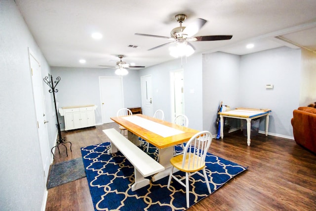 dining room featuring ceiling fan and dark wood-type flooring