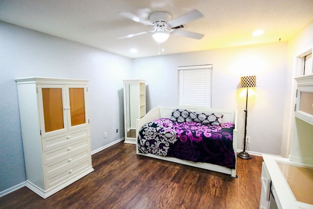 bedroom featuring ceiling fan and dark wood-type flooring