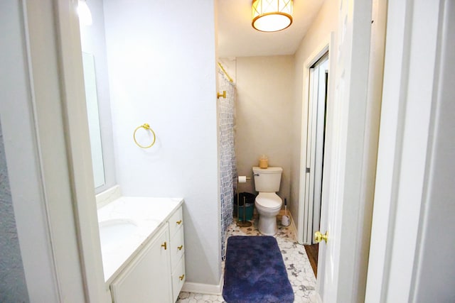 bathroom with vanity, tile flooring, and toilet