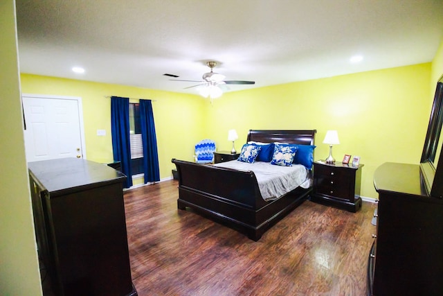 bedroom featuring dark hardwood / wood-style flooring and ceiling fan