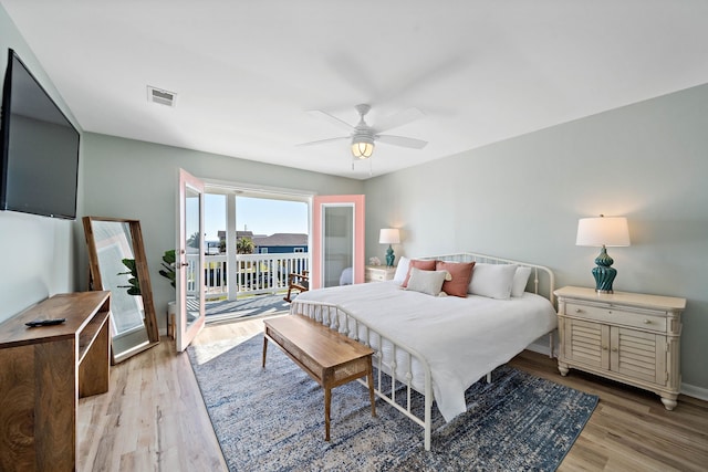 bedroom featuring access to exterior, ceiling fan, and light wood-type flooring