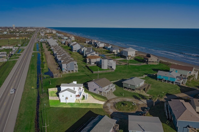 drone / aerial view with a water view and a view of the beach