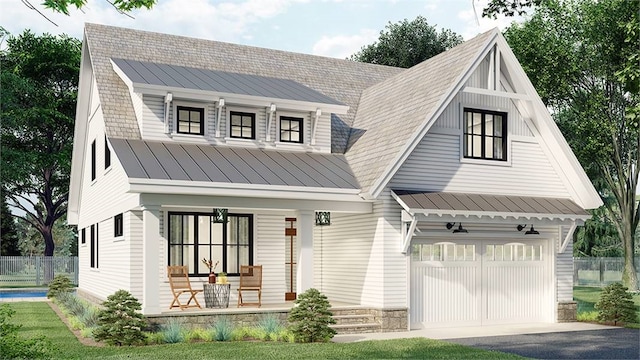 view of front of home with a porch and a garage