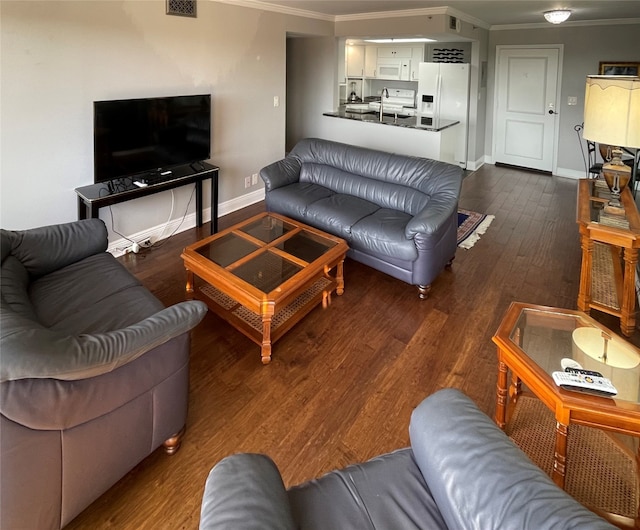 living room featuring ornamental molding and dark wood-type flooring