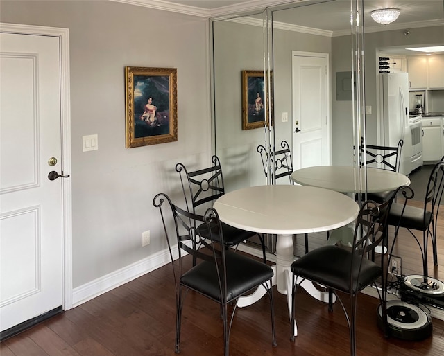 dining space with dark wood-type flooring and crown molding