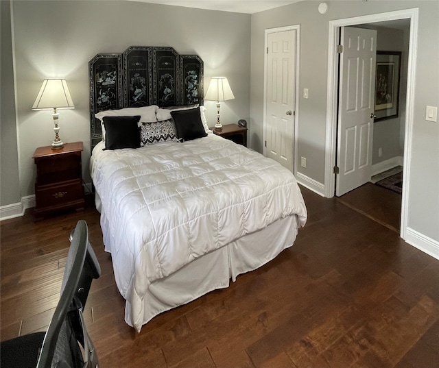 bedroom featuring a closet and dark hardwood / wood-style flooring