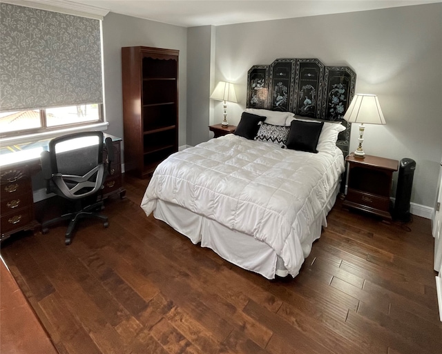 bedroom with dark wood-type flooring