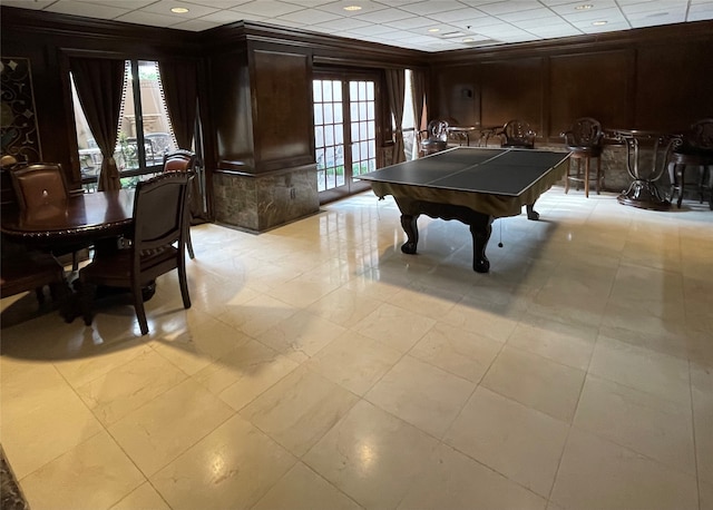 rec room with pool table, french doors, light tile floors, and a paneled ceiling