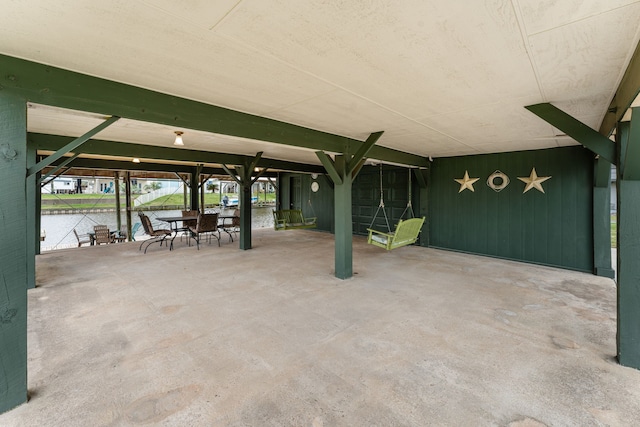 view of patio with a water view