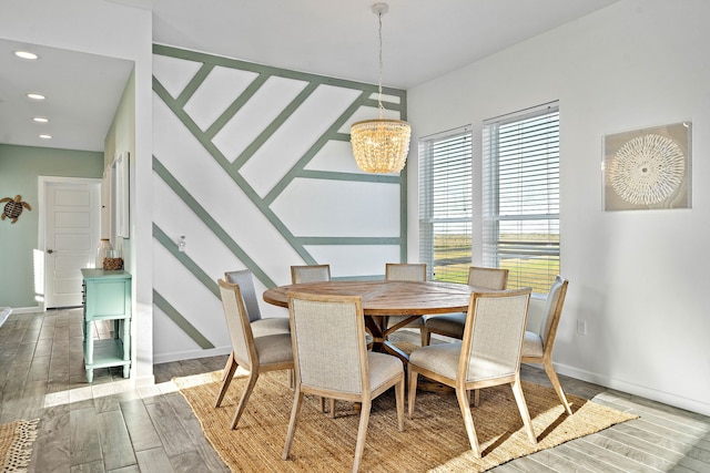 dining room featuring a chandelier and dark hardwood / wood-style flooring