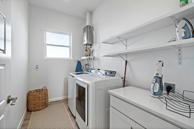 washroom with dark hardwood / wood-style flooring and washer and dryer