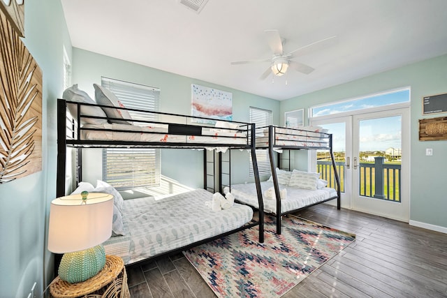 bedroom featuring french doors, dark hardwood / wood-style flooring, ceiling fan, and access to exterior