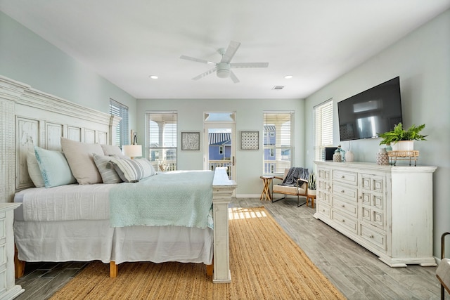 bedroom featuring ceiling fan and light wood-type flooring