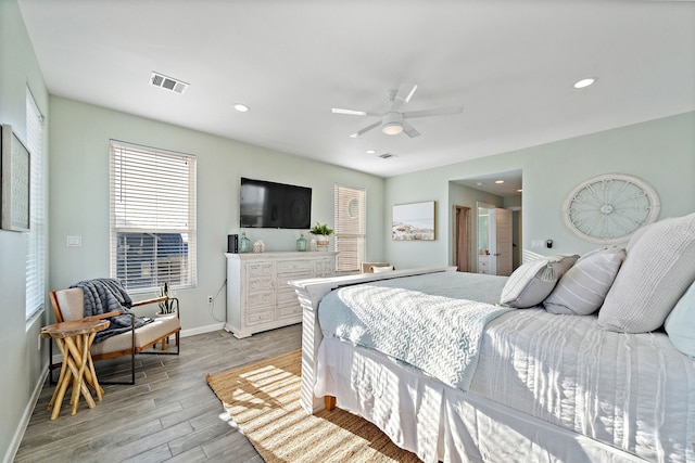 bedroom featuring light hardwood / wood-style floors and ceiling fan