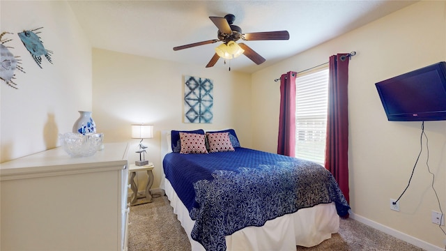 bedroom featuring ceiling fan and light carpet