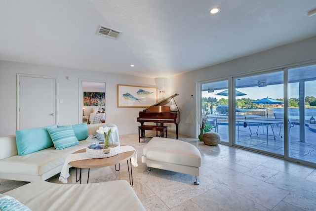 living room with a textured ceiling