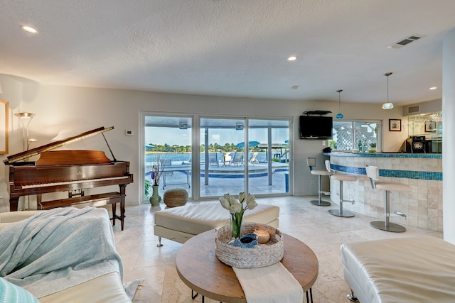 living room with a textured ceiling