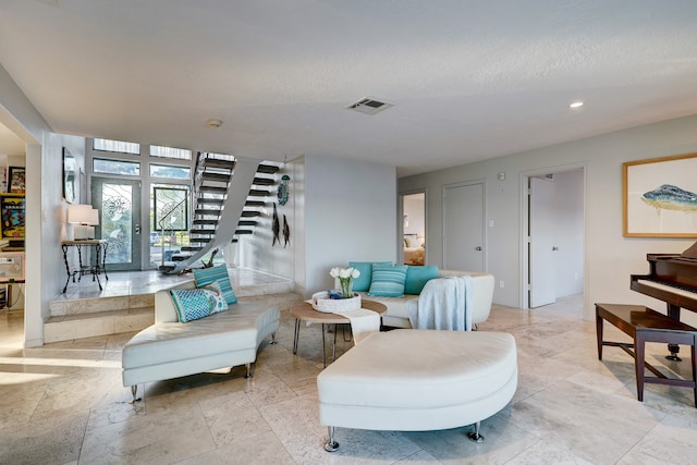 living room with a textured ceiling