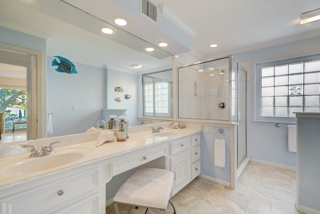 bathroom featuring a shower with shower door, ornamental molding, and a healthy amount of sunlight