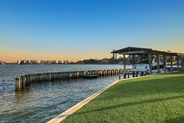 dock area featuring a water view and a yard