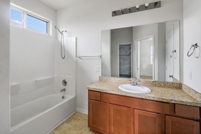 bathroom with tile floors, shower / bathing tub combination, and vanity