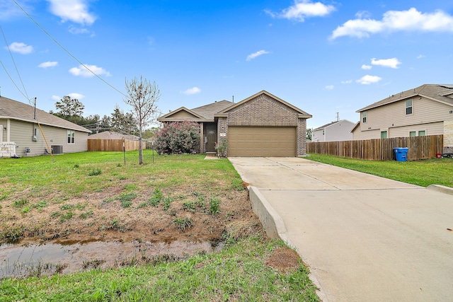 single story home featuring central AC unit, a front lawn, and a garage