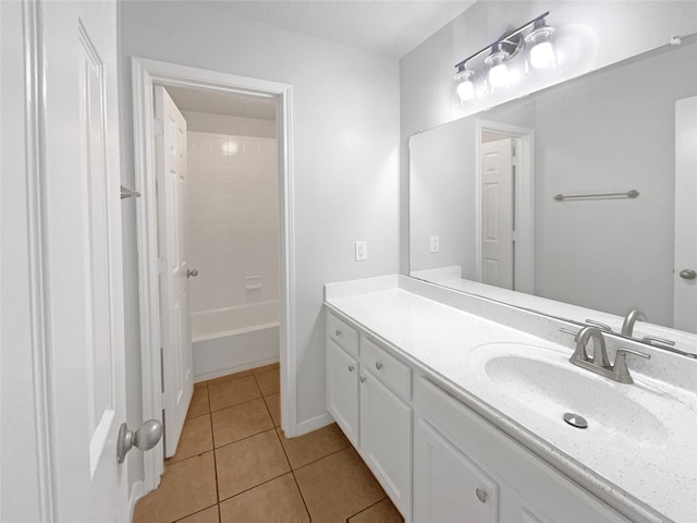 bathroom featuring tile flooring, shower / bathtub combination, and vanity