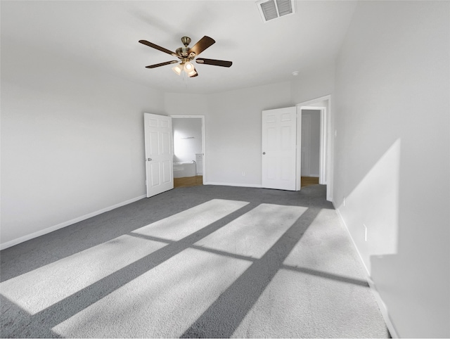 unfurnished room with ceiling fan and light colored carpet