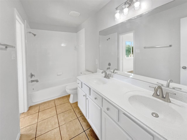 full bathroom featuring tile floors, large vanity, dual sinks, toilet, and shower / tub combination