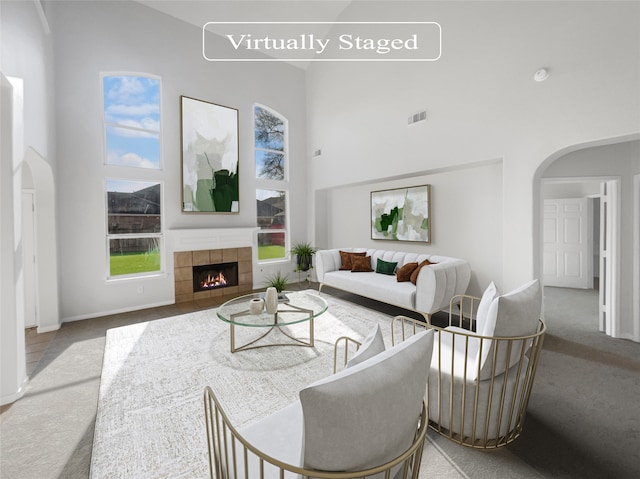 carpeted living room with a fireplace