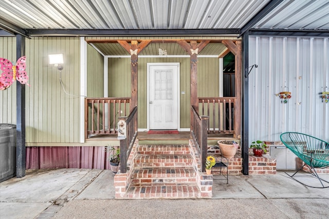 view of exterior entry with covered porch