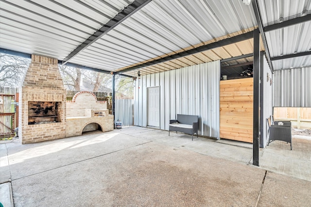 view of stable featuring an outdoor brick fireplace