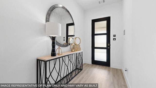 entrance foyer with light hardwood / wood-style floors