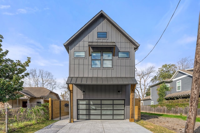 modern inspired farmhouse featuring a garage