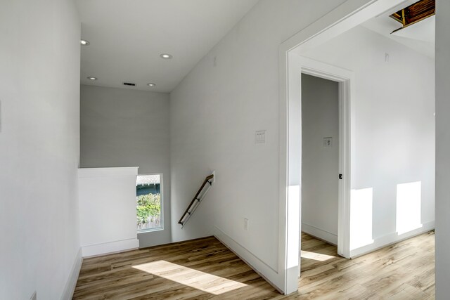 stairway featuring light hardwood / wood-style floors