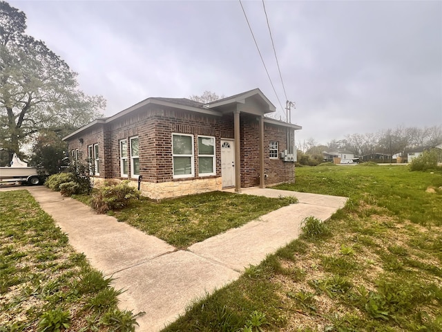 view of side of property with a yard