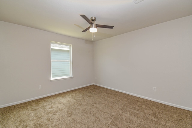 carpeted empty room with ceiling fan