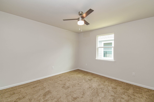 empty room with carpet and ceiling fan