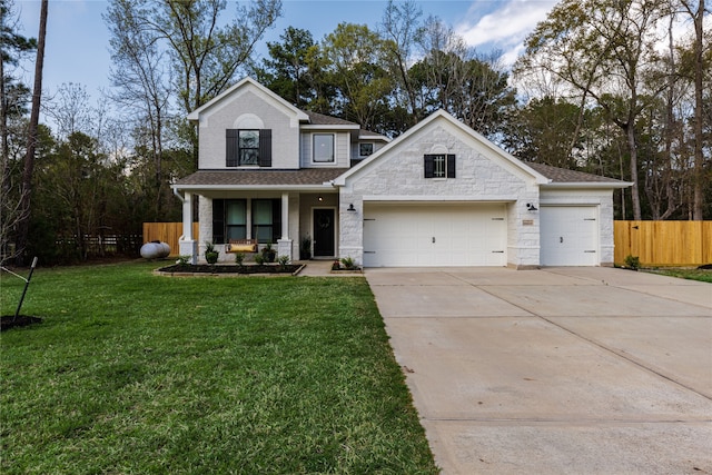 view of front of home with a porch, a front yard, and a garage