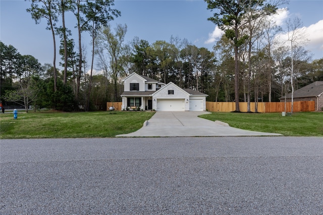 view of front of house featuring a garage and a front yard