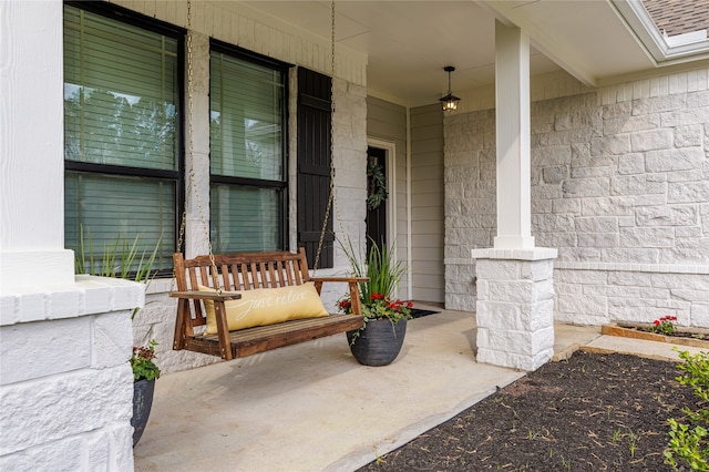 doorway to property featuring a porch