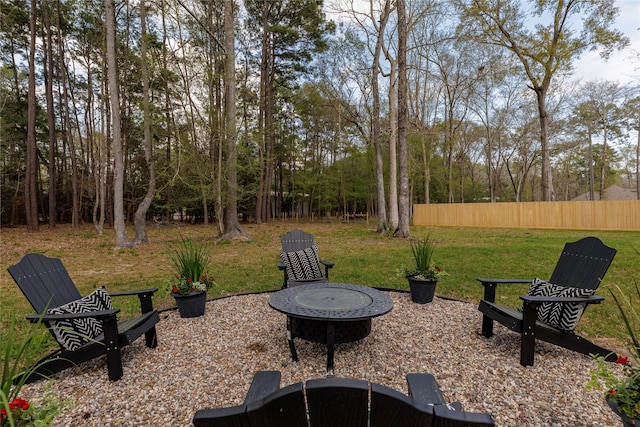 view of yard with a fire pit